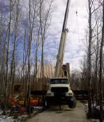 Thumbnail image of 33 ton crane lifting wooden beams