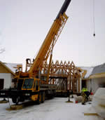 Thumbnail image of 70 ton crane lifting wooden beams