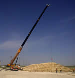 Thumbnail image of 70 ton crane lifting 5-6,000lb sections of rafters