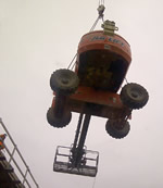 Thumbnail image of lifting a man lift on bridge